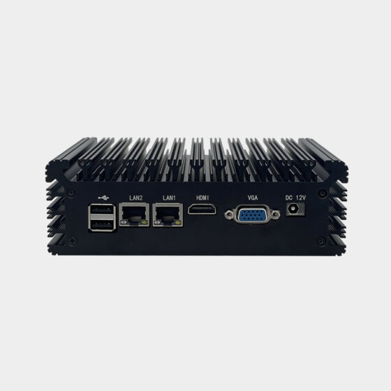 The NANO200 fanless industrial computer is displayed from a rear angle perspective, showing USB interfaces, dual COM serial ports, an audio connector and the rugged aluminum enclosure. The design supports industrial communication and embedded system integration.